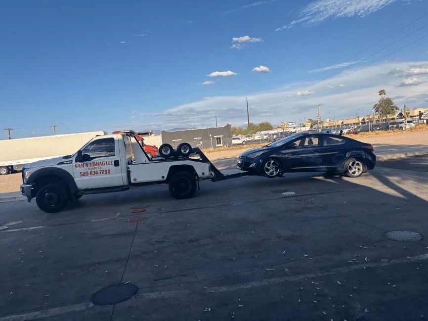 Vehicle receiving a professional jumpstart in a Tucson parking lot